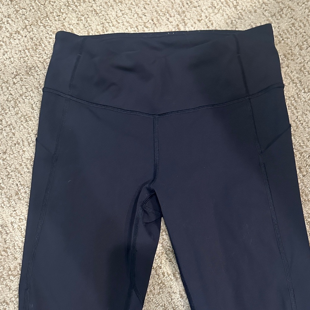 Lululemon size 4 Black leggings zippered back pocket and side pockets